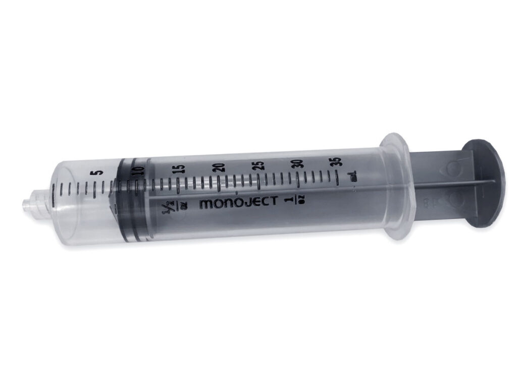 Epoxy Glue Syringe Applicator Stock Photo - Download Image Now